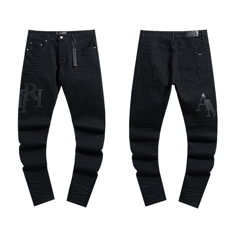 Amiri Distressed Splash Ink Stretch Slim Tapered Denim Jeans Unisex